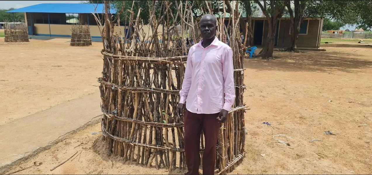 Community leaders monitoring project activities at a protected planting site.